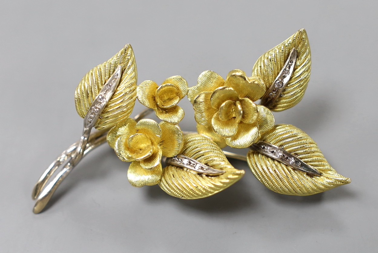 A 1960's two colour 18ct gold and diamond chip set floral spray brooch, maker CJ Ltd